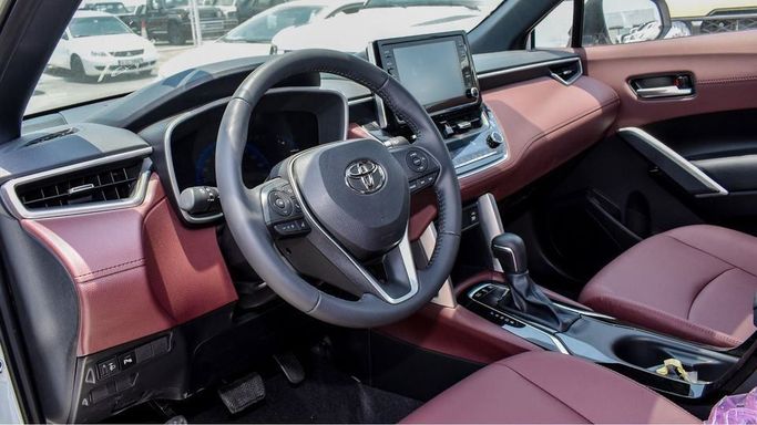 New Toyota Corolla Cross I, 1.8 l, 2024 in Dubai by Najem Motors, White color. GCC Specs | AUTO.AE