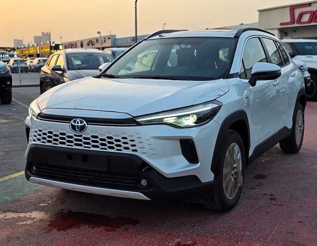 New Toyota Corolla Cross I, 1.8 l, 2025 in Dubai by Soltan Auto, White color. GCC Specs | AUTO.AE
