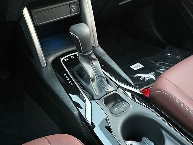 New Toyota Corolla Cross I, 1.8 l, 2025 in Dubai by Soltan Auto, White color. GCC Specs | AUTO.AE