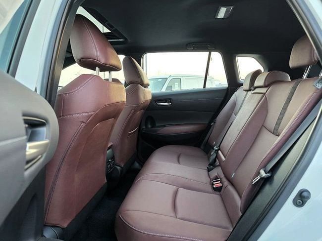 New Toyota Corolla Cross I, 1.8 l, 2025 in Dubai by Soltan Auto, White color. GCC Specs | AUTO.AE