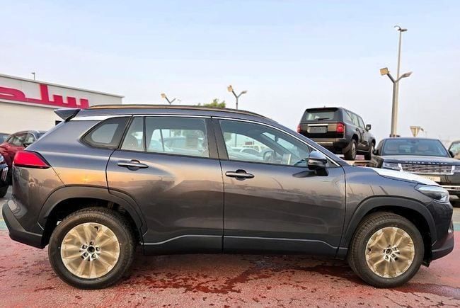New Toyota Corolla Cross I, 1.8 l, 2025 in Dubai by Soltan Auto, Grey color. GCC Specs | AUTO.AE