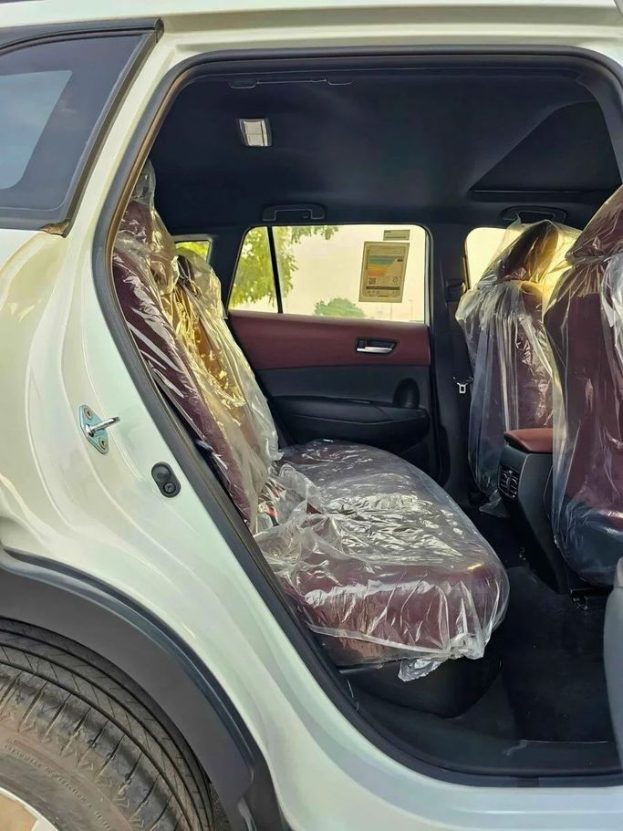 New Toyota Corolla Cross I, 1.8 l, 2024 in Dubai by SK Motors, White color. Other | AUTO.AE