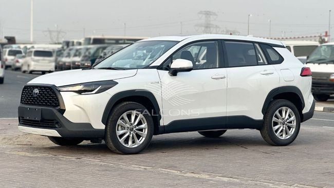 New Toyota Corolla Cross I, 2.0 l, 2024 in Dubai by Falcons GT Motors FZCO, White color. European Specs | AUTO.AE