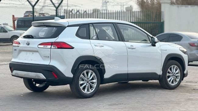 New Toyota Corolla Cross I, 2.0 l, 2024 in Dubai by Falcons GT Motors FZCO, White color. European Specs | AUTO.AE