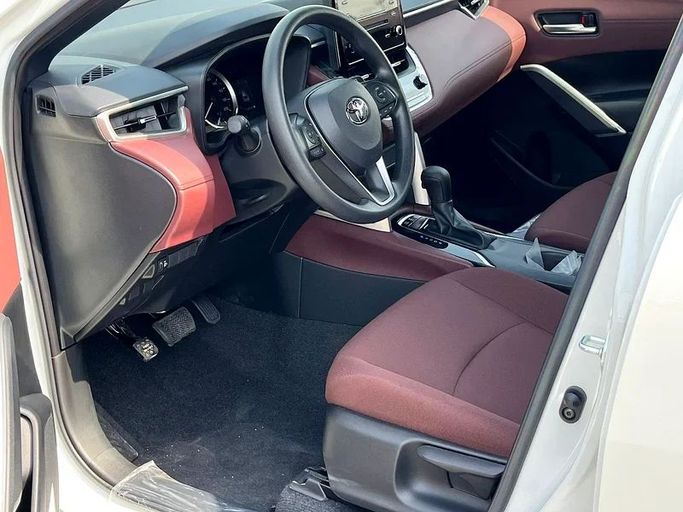 New Toyota Corolla Cross I, 1.8 l, 2024 in Dubai by We Can Motors, White color. GCC Specs | AUTO.AE