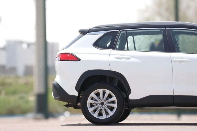 New Toyota Corolla Cross I, 1.8 l, 2024 in Dubai by Atlantic Motors FZCO, White color. GCC Specs | AUTO.AE