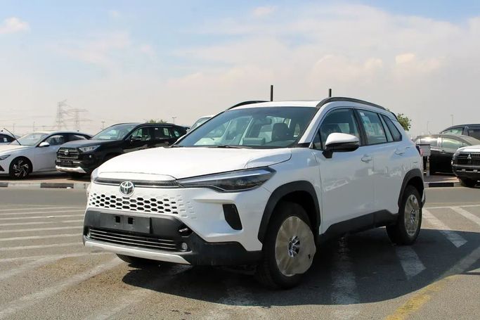 New Toyota Corolla Cross I, 1.8 l, 2025 in Dubai by Wafrah Automotive Fzco, White color. GCC Specs | AUTO.AE