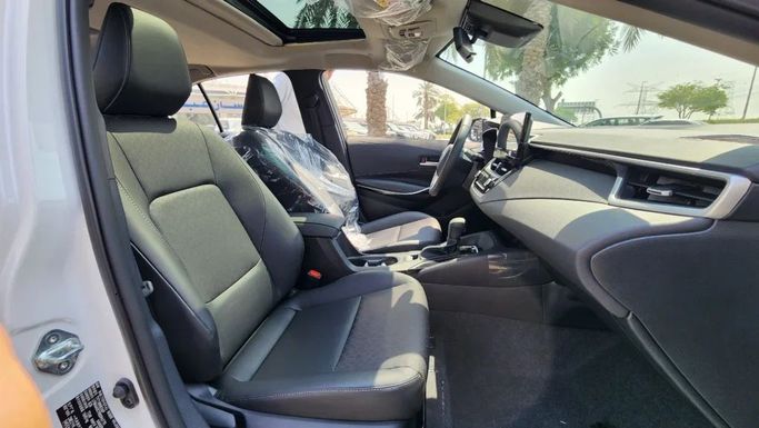 New Toyota Corolla Sporty XII (E210), 1.8 l, 2024 in Dubai by Alwan Global Cars, White color. Other | AUTO.AE