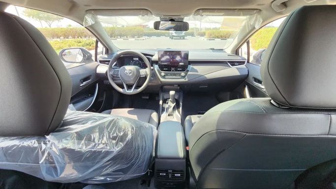 New Toyota Corolla Sporty XII (E210), 1.8 l, 2024 in Dubai by Alwan Global Cars, White color. Other | AUTO.AE
