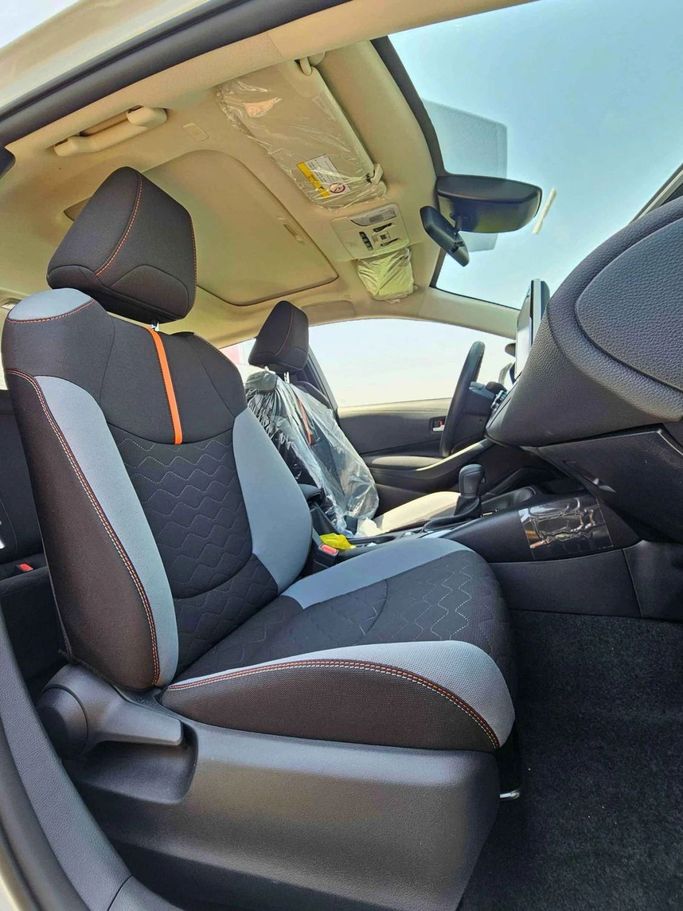 New Toyota Corolla Sporty XII (E210), 1.2 l, 2023 in Dubai by SK Motors, White color. Chinese Specs | AUTO.AE