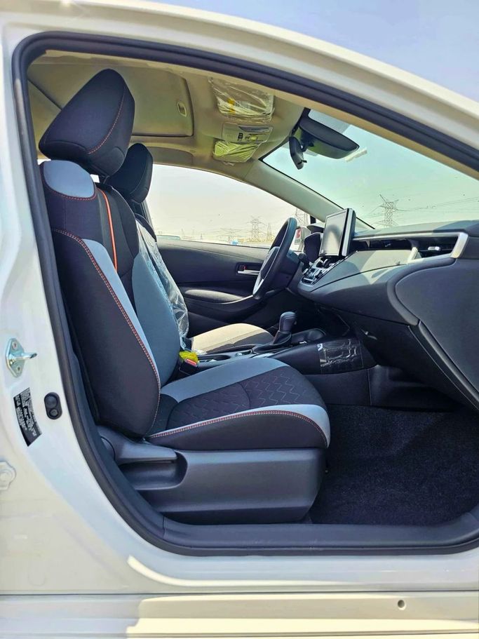 New Toyota Corolla Sporty XII (E210), 1.2 l, 2023 in Dubai by SK Motors, White color. Chinese Specs | AUTO.AE