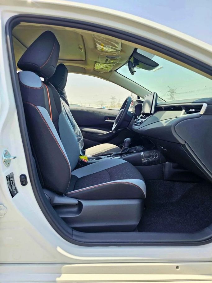 New Toyota Corolla XII (E210), 1.2 l, 2023 in Dubai by SK Motors, White color. Chinese Specs | AUTO.AE