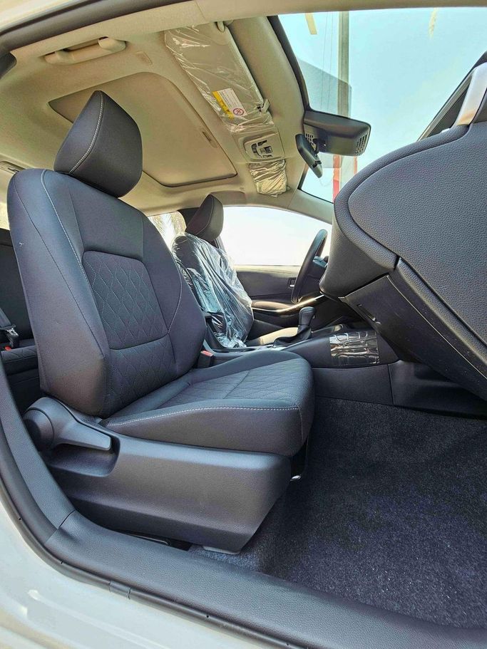 New Toyota Corolla XII (E210), 1.8 l, 2025 in Dubai by SK Motors, White color. Chinese Specs | AUTO.AE