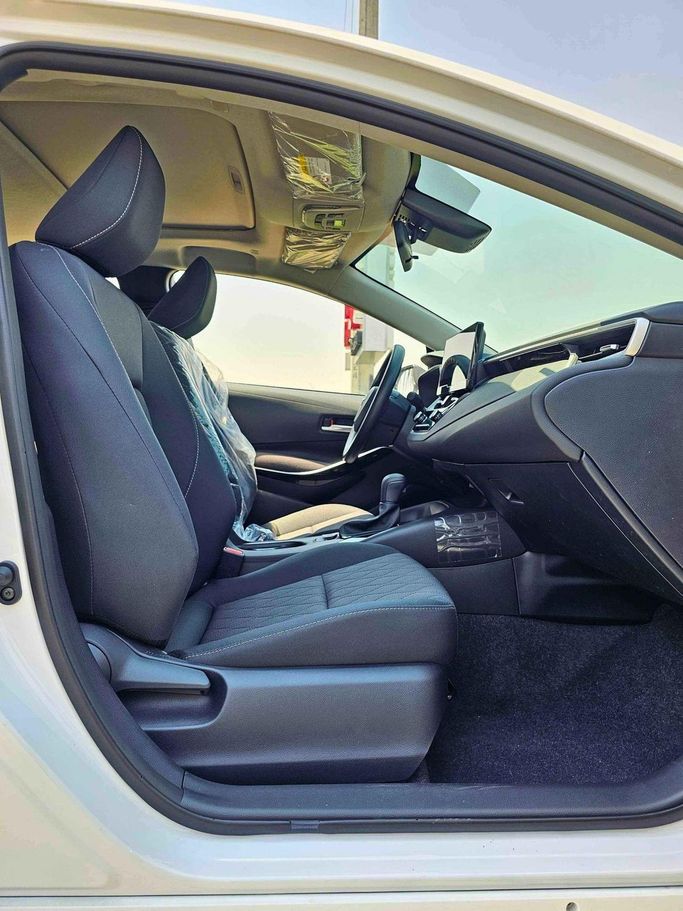 New Toyota Corolla XII (E210), 1.8 l, 2025 in Dubai by SK Motors, White color. Chinese Specs | AUTO.AE