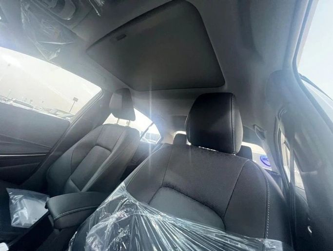Новый Toyota Corolla Sporty XII (E210) Рестайлинг, 1.8 л, 2024 в Дубае от World Center Motors FZE Белый цвет. Китайская | AUTO.AE