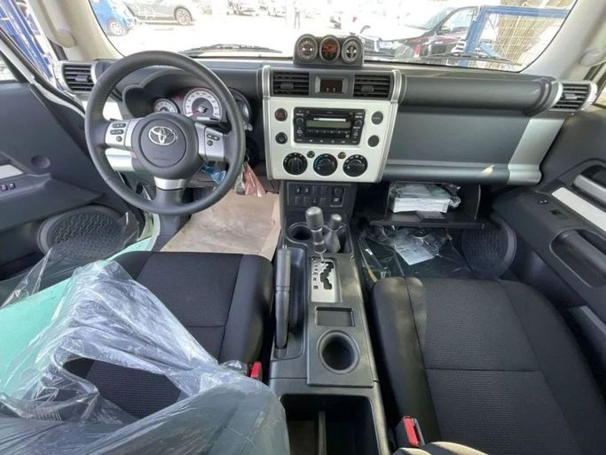 New Toyota FJ Cruiser, 4.0 l, 2023 in Dubai by Mohamed Hakim Motors, Yellow color. GCC Specs | AUTO.AE