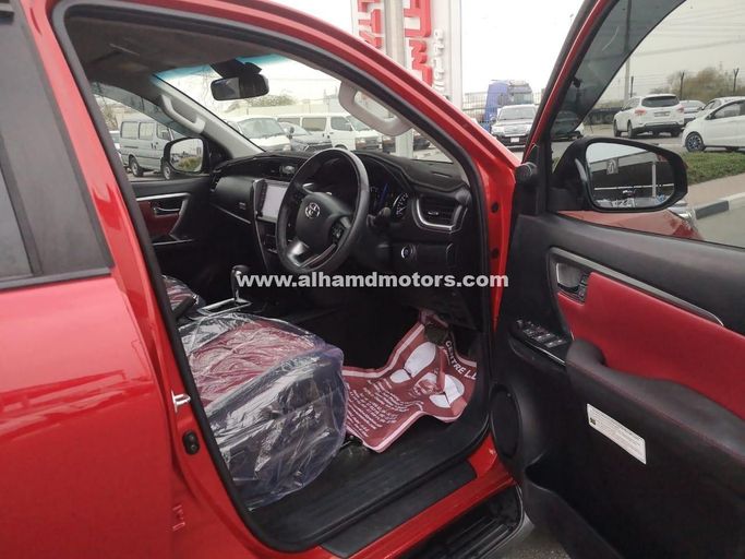 Used Toyota Fortuner II Facelift, 2.8 l, 2021 in Dubai by Alhamd Motors, Red color. Other | AUTO.AE