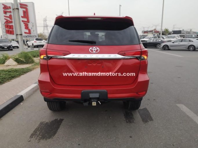 Used Toyota Fortuner II Facelift, 2.8 l, 2021 in Dubai by Alhamd Motors, Red color. Other | AUTO.AE
