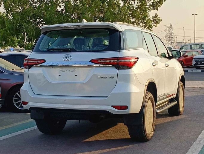 New Toyota Fortuner II Facelift, 4.0 l, 2024 in Dubai by SK Motors, White color. GCC Specs | AUTO.AE