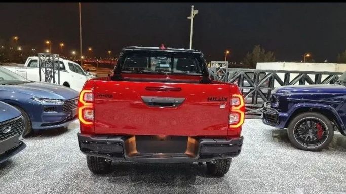 New Toyota Hilux VIII Facelift, 4.0 l, 2024 in Dubai by Mohamed Hakim Motors, Red color. GCC Specs | AUTO.AE