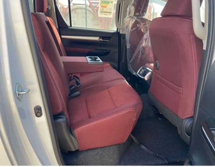 New Toyota Hilux VIII Facelift, 2.7 l, 2023 in Dubai by Mohamed Hakim Motors, White color. GCC Specs | AUTO.AE