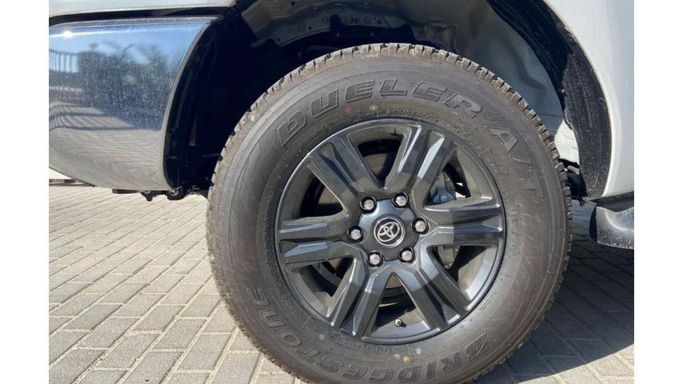 New Toyota Hilux VIII Facelift, 2.7 l, 2023 in Dubai by Mohamed Hakim Motors, White color. GCC Specs | AUTO.AE