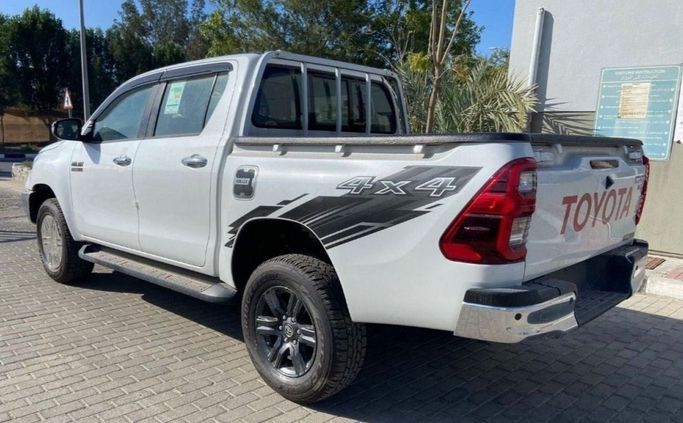 New Toyota Hilux VIII Facelift, 2.7 l, 2023 in Dubai by Mohamed Hakim Motors, White color. GCC Specs | AUTO.AE