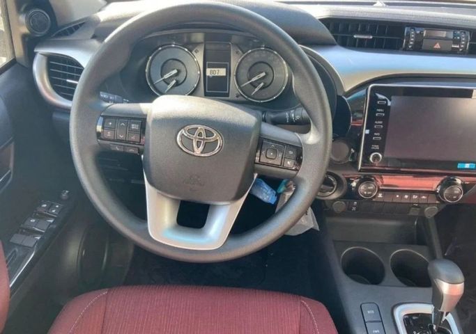 New Toyota Hilux VIII Facelift, 2.7 l, 2023 in Dubai by Mohamed Hakim Motors, White color. GCC Specs | AUTO.AE