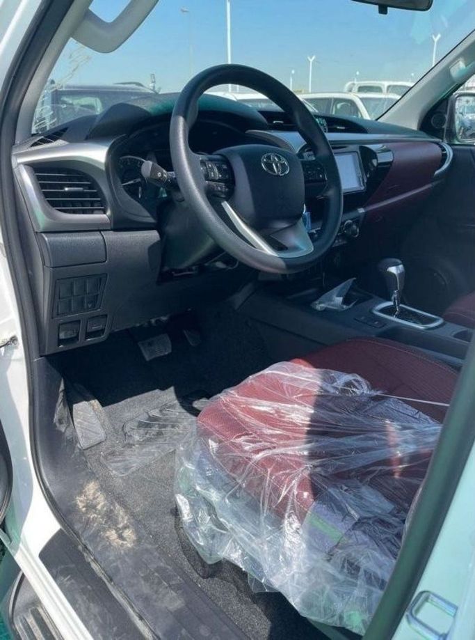 New Toyota Hilux VIII Facelift, 2.7 l, 2024 in Dubai by Mohamed Hakim Motors, White color. GCC Specs | AUTO.AE