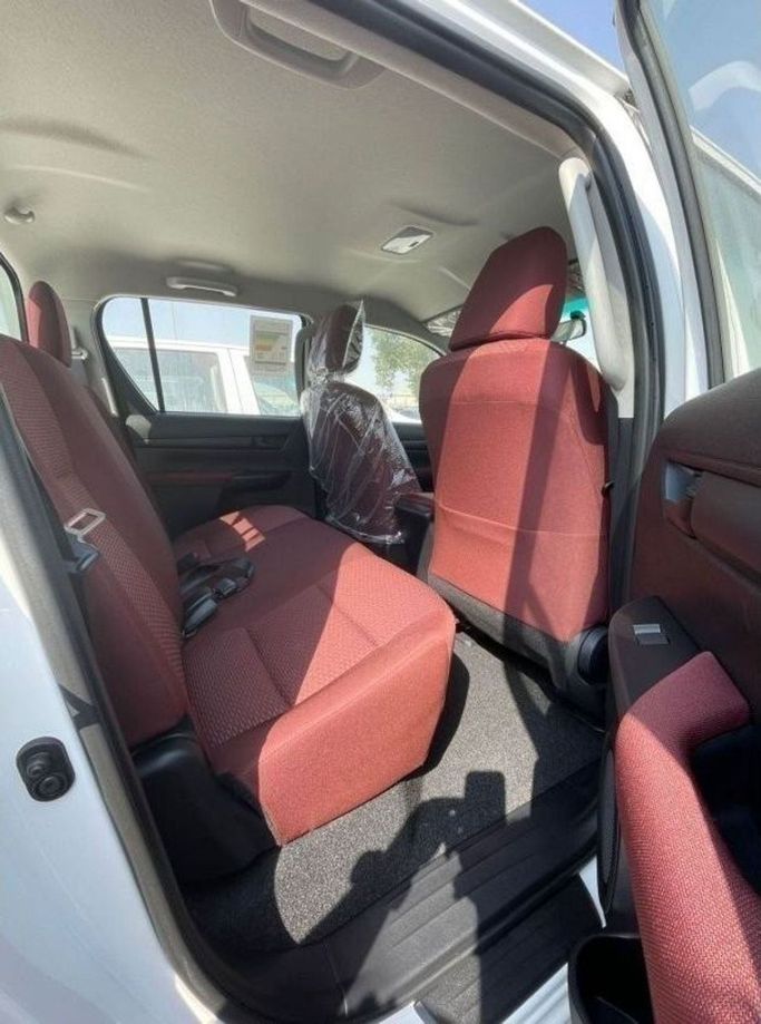 New Toyota Hilux VIII Facelift, 2.7 l, 2024 in Dubai by Mohamed Hakim Motors, White color. GCC Specs | AUTO.AE