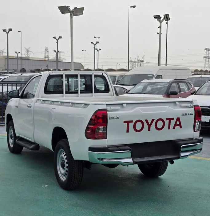 New Toyota Hilux Extra Cab VIII Facelift, 2.4 l, 2025 in Dubai by Mohamed Hakim Motors, White color. GCC Specs | AUTO.AE