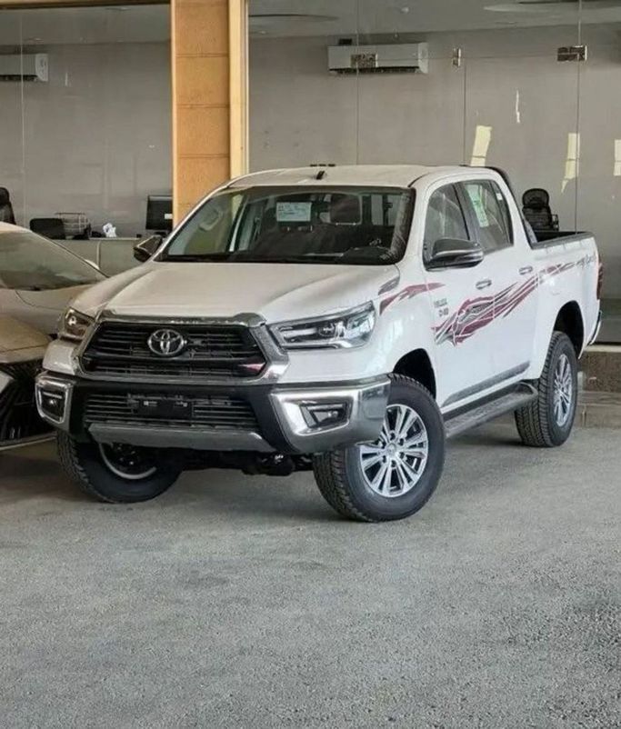 New Toyota Hilux VIII Facelift, 2.8 l, 2024 in Dubai by Mohamed Hakim Motors, White color. GCC Specs | AUTO.AE