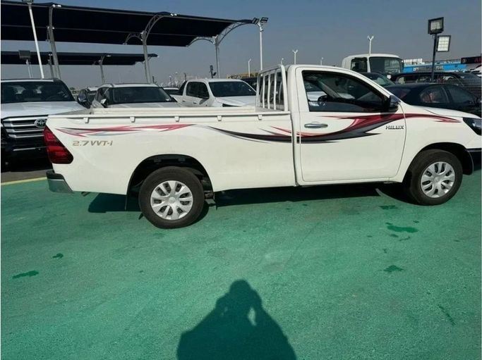 New Toyota Hilux VIII Facelift 2, 2.7 l, 2025 in Dubai by Mohamed Hakim Motors, White color. GCC Specs | AUTO.AE