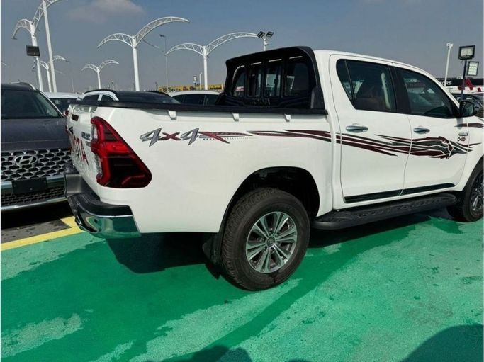New Toyota Hilux VIII Facelift 2, 2.4 l, 2025 in Dubai by Mohamed Hakim Motors, White color. GCC Specs | AUTO.AE