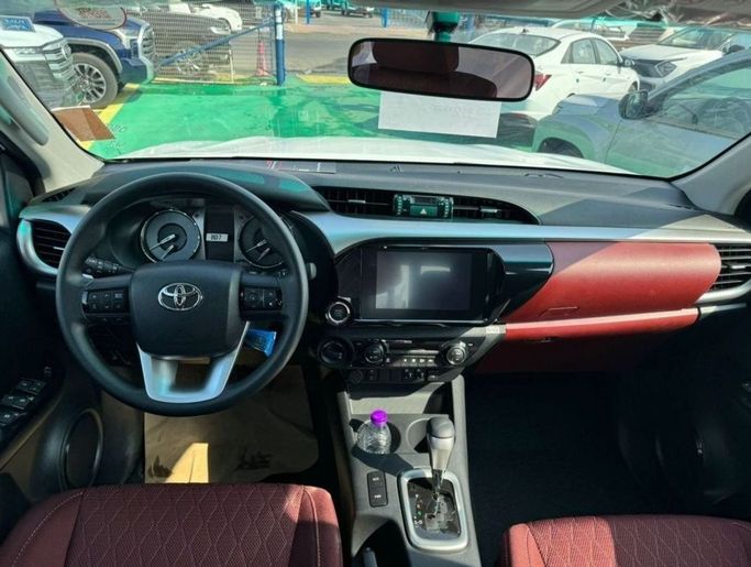New Toyota Hilux VIII Facelift 2, 2.4 l, 2025 in Dubai by Mohamed Hakim Motors, White color. GCC Specs | AUTO.AE