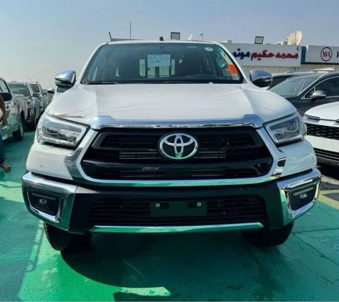 New Toyota Hilux VIII Facelift 2, 2.4 l, 2025 in Dubai by Mohamed Hakim Motors, White color. GCC Specs | AUTO.AE