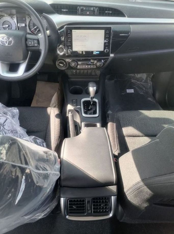 New Toyota Hilux VIII Facelift, 2.4 l, 2023 in Dubai by Mohamed Hakim Motors, Grey color. GCC Specs | AUTO.AE