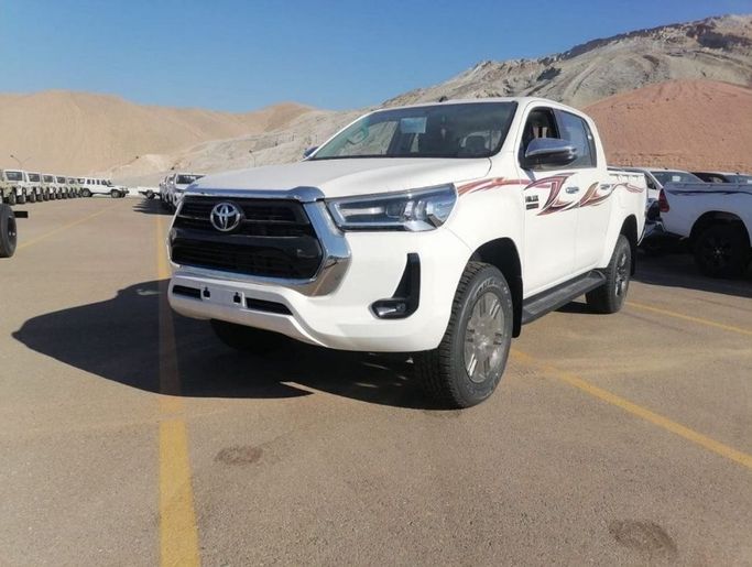 New Toyota Hilux VIII Facelift, 2.4 l, 2023 in Dubai by Mohamed Hakim Motors, White color. GCC Specs | AUTO.AE