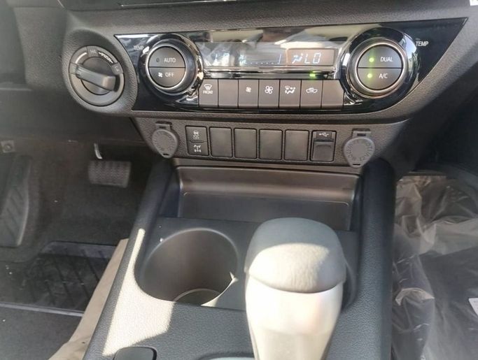 New Toyota Hilux VIII Facelift, 2.4 l, 2023 in Dubai by Mohamed Hakim Motors, White color. GCC Specs | AUTO.AE