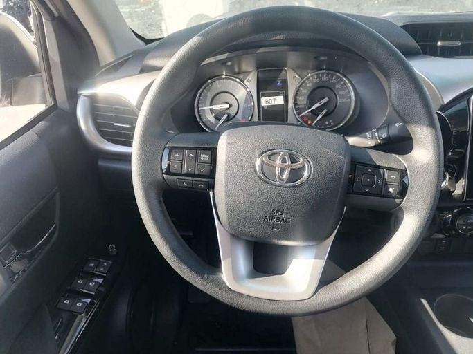 New Toyota Hilux VIII Facelift, 2.4 l, 2023 in Dubai by Mohamed Hakim Motors, White color. GCC Specs | AUTO.AE