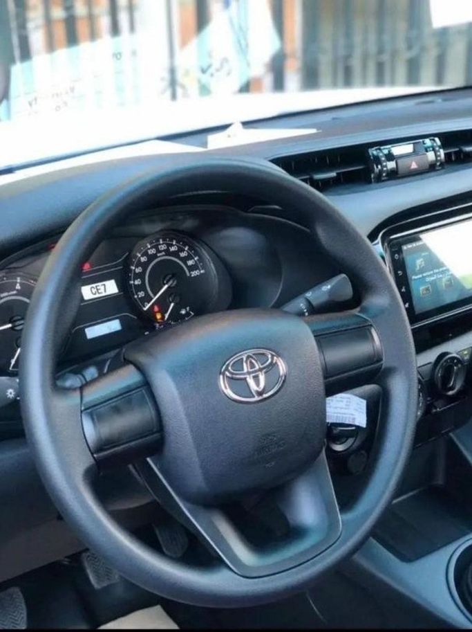 New Toyota Hilux VIII Facelift 2, 2.4 l, 2024 in Dubai by Mohamed Hakim Motors, White color. GCC Specs | AUTO.AE
