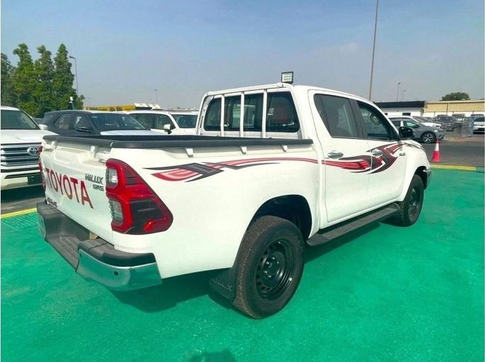 New Toyota Hilux VIII Facelift, 2.8 l, 2023 in Dubai by Mohamed Hakim Motors, White color. GCC Specs | AUTO.AE