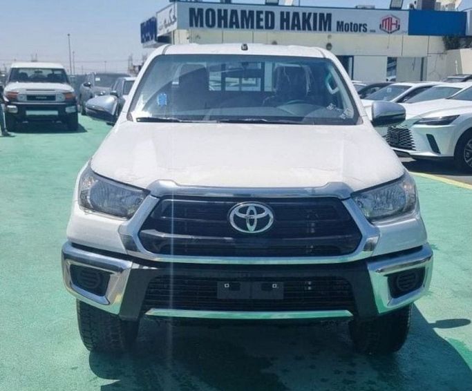 New Toyota Hilux VIII Facelift, 2.7 l, 2023 in Dubai by Mohamed Hakim Motors, White color. GCC Specs | AUTO.AE