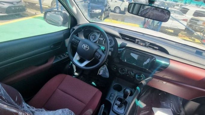 New Toyota Hilux VIII Facelift, 2.7 l, 2023 in Dubai by Mohamed Hakim Motors, White color. GCC Specs | AUTO.AE