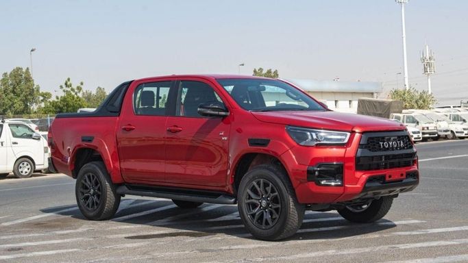 New Toyota Hilux VIII Facelift, 4.0 l, 2023 in Dubai by Mohamed Hakim Motors, Red color. GCC Specs | AUTO.AE