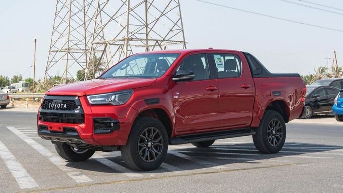 New Toyota Hilux VIII Facelift, 4.0 l, 2023 in Dubai by Mohamed Hakim Motors, Red color. GCC Specs | AUTO.AE
