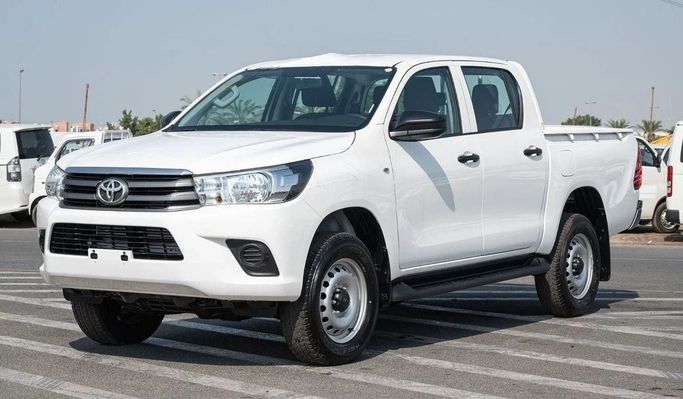 New Toyota Hilux Extra Cab VIII Facelift, 2.4 l, 2023 in Dubai by Mohamed Hakim Motors, White color. GCC Specs | AUTO.AE