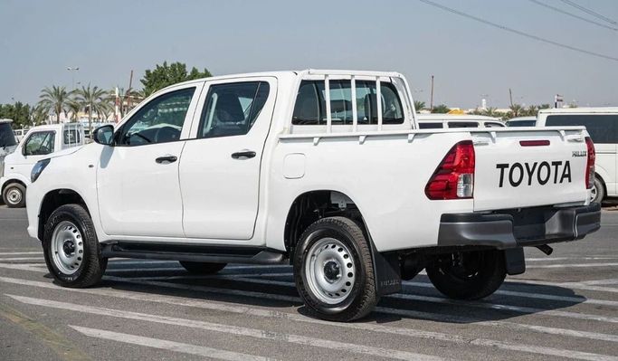 New Toyota Hilux Extra Cab VIII Facelift, 2.4 l, 2023 in Dubai by Mohamed Hakim Motors, White color. GCC Specs | AUTO.AE