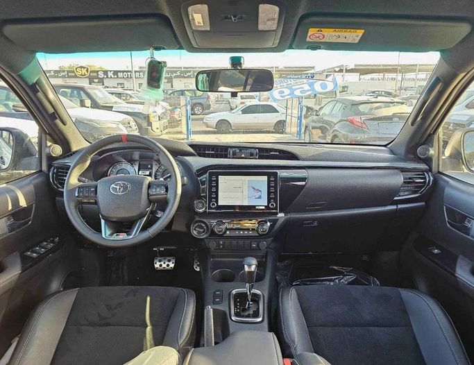 New Toyota Hilux VIII Facelift, 4.0 l, 2025 in Dubai by SK Motors, White color. GCC Specs | AUTO.AE