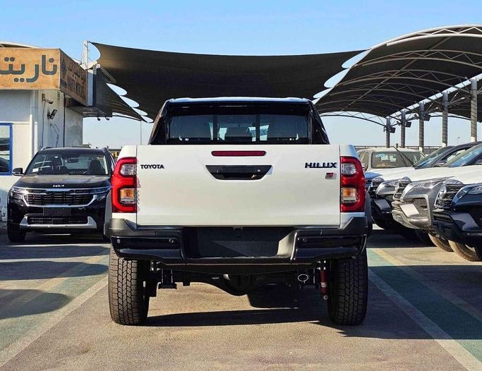 New Toyota Hilux VIII Facelift, 4.0 l, 2025 in Dubai by SK Motors, White color. GCC Specs | AUTO.AE